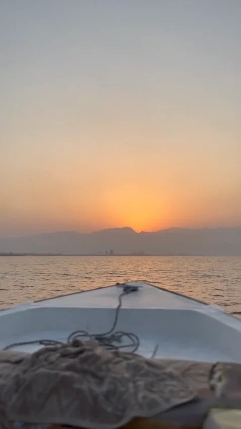 Coastal water at sunset, viewed from a small boat
